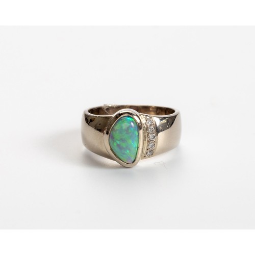 512 - AN OPAL AND DIAMOND RING, CHERRY DESIGN