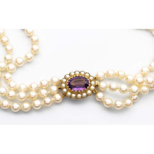 521 - A TRIPLE-STRAND PEARL CHOKER