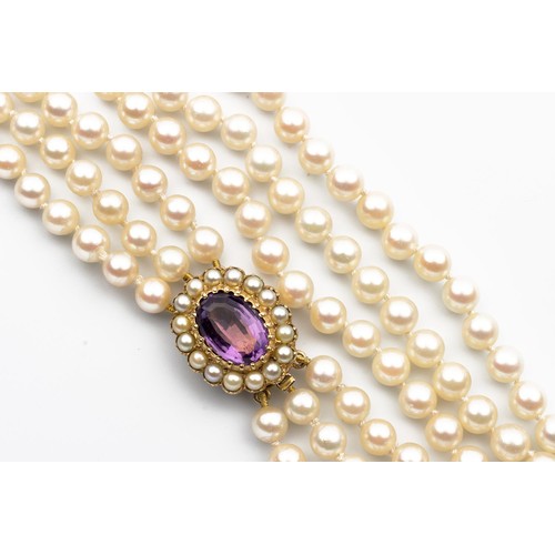 521 - A TRIPLE-STRAND PEARL CHOKER