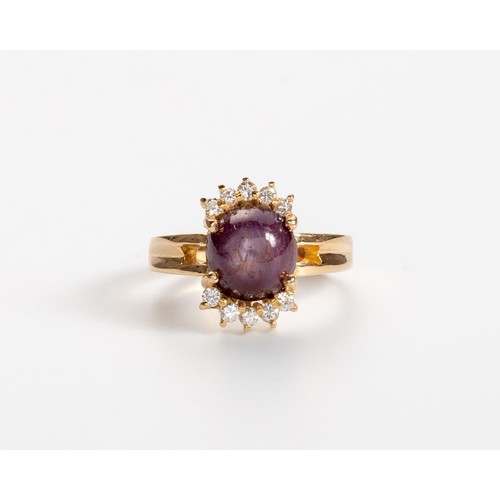 536 - A PINK-PURPLE STAR SAPPHIRE AND DIAMOND RING