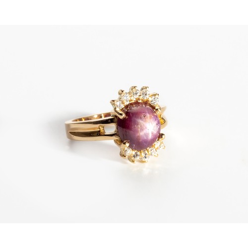 536 - A PINK-PURPLE STAR SAPPHIRE AND DIAMOND RING