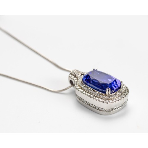 552 - A TANZANITE AND DIAMOND PENDANT