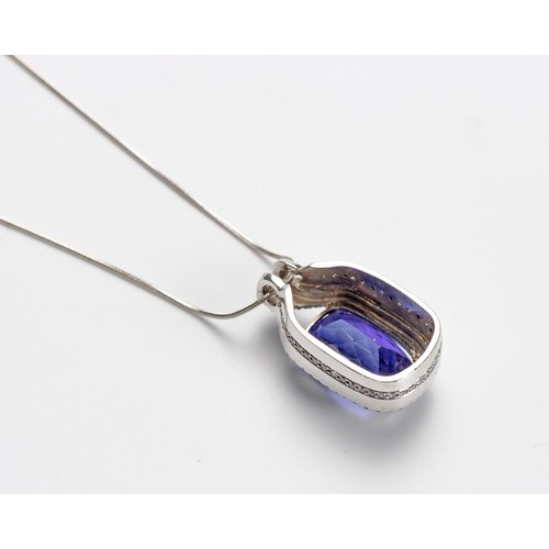 552 - A TANZANITE AND DIAMOND PENDANT