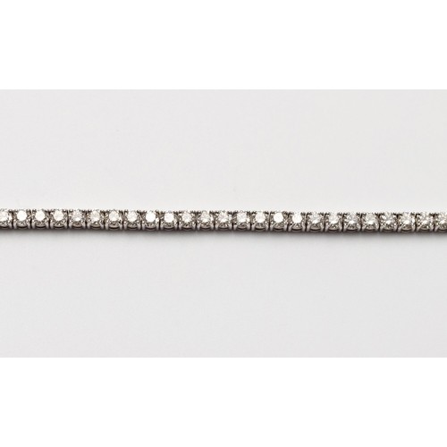 554 - A DIAMOND TENNIS BRACELET