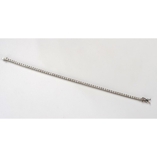 556 - A DIAMOND TENNIS BRACELET