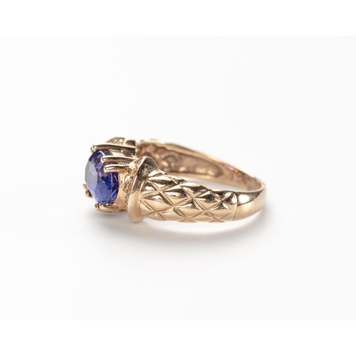 564 - A TANZANITE AND DIAMOND RING