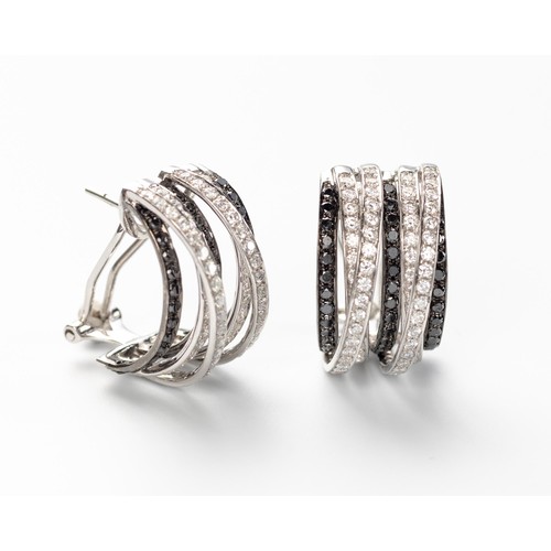 567 - A PAIR OF BLACK AND WHITE DIAMOND EARRINGS