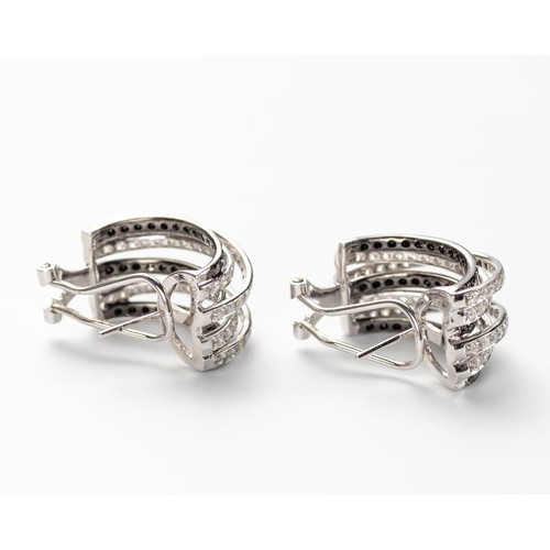 567 - A PAIR OF BLACK AND WHITE DIAMOND EARRINGS