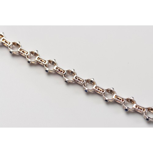 571 - A RUBY, DIAMOND AND SAPPHIRE BRACELET