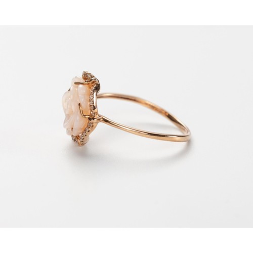 573 - A CARVED SHELL AND DIAMOND RING