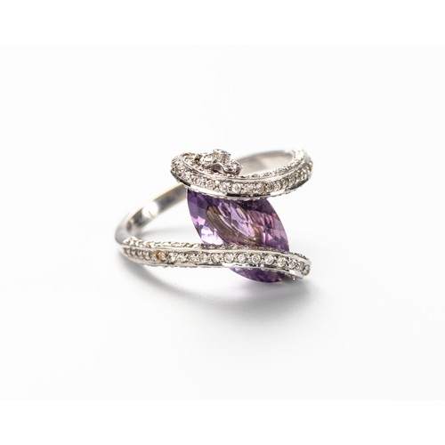 574 - AN AMETHYST AND DIAMOND RING