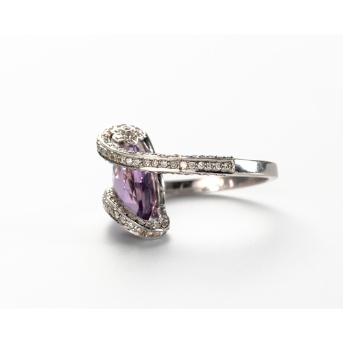 574 - AN AMETHYST AND DIAMOND RING