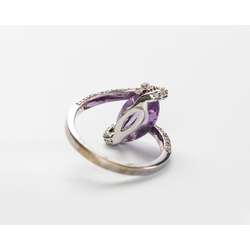 574 - AN AMETHYST AND DIAMOND RING