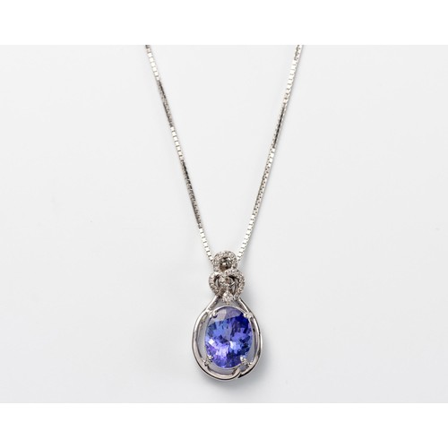 575 - A TANZANITE AND DIAMOND PENDANT