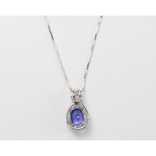 575 - A TANZANITE AND DIAMOND PENDANT