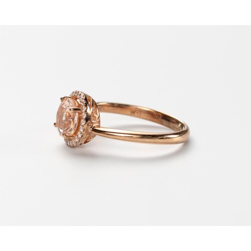 580 - A MORGANITE AND DIAMOND RING