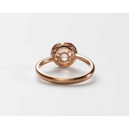 580 - A MORGANITE AND DIAMOND RING