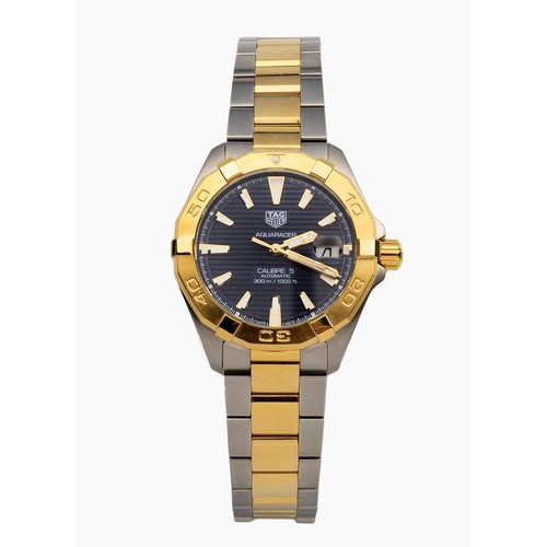 186 - A TWO-TONE STAINLESS STEEL AND GILT METAL WRISTWATCH, TAG HEUER CALIBRE 5 AQUARACER