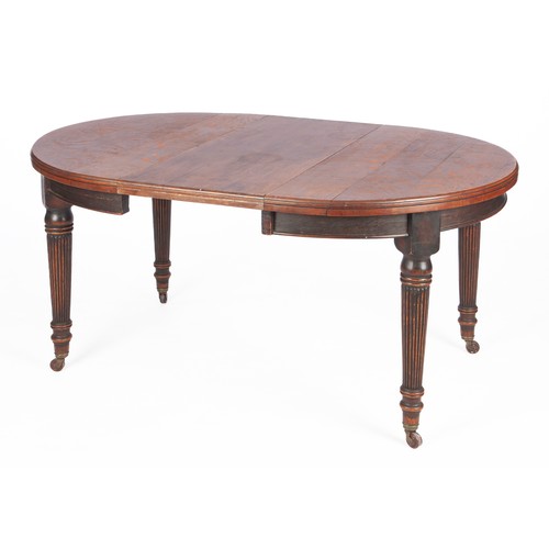 548 - A LATE VICTORIAN OAK DINING TABLE