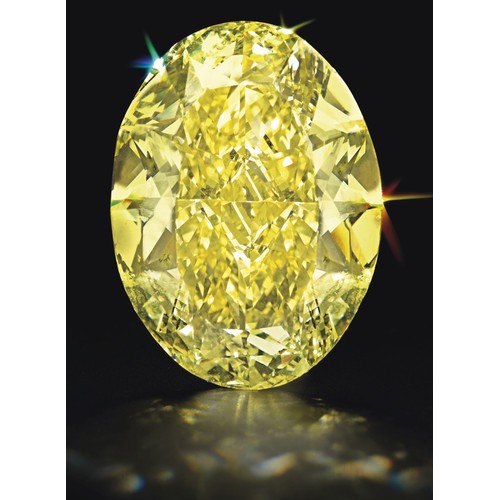 1130 - AN OVAL BRILLIANT CUT YELLOW DIAMOND 0,51 CARATS