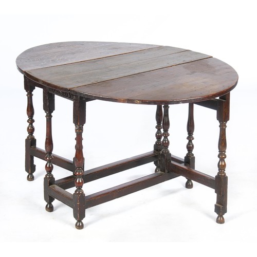 534 - AN OAK GATE-LEG TABLE, 19TH CENTURY