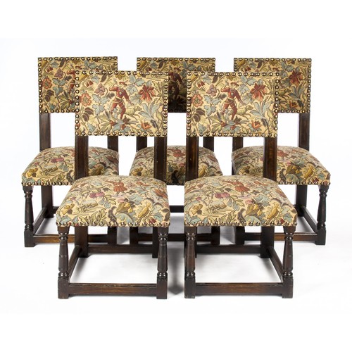 769 - A SET OF TEN CROMELLIAN-STYLE STAINED OAK DINING CHAIRS