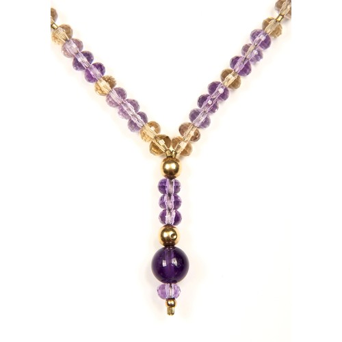 976 - AN AMETHYST AND GOLD CHAIN