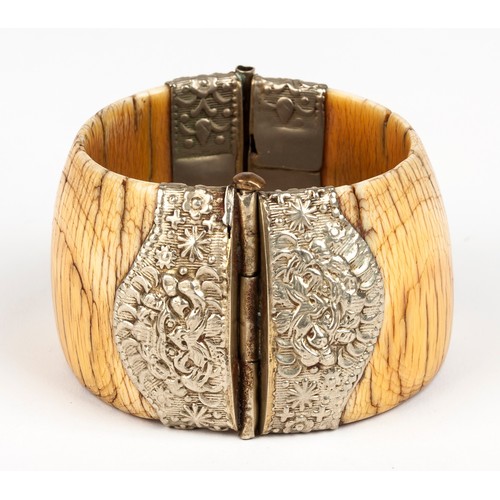 968 - A TUSK AND METAL BANGLE