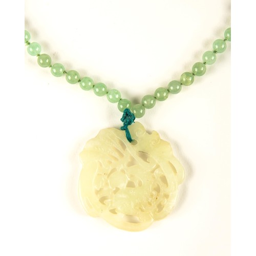 972 - A JADE NECKLACE AND PENDANT