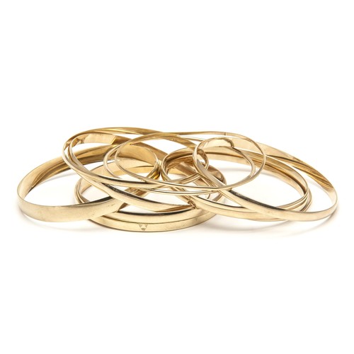 991 - A COLLECTION OF GOLD BANGLES