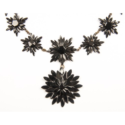 1014 - A GARNET DAISY NECKLACE