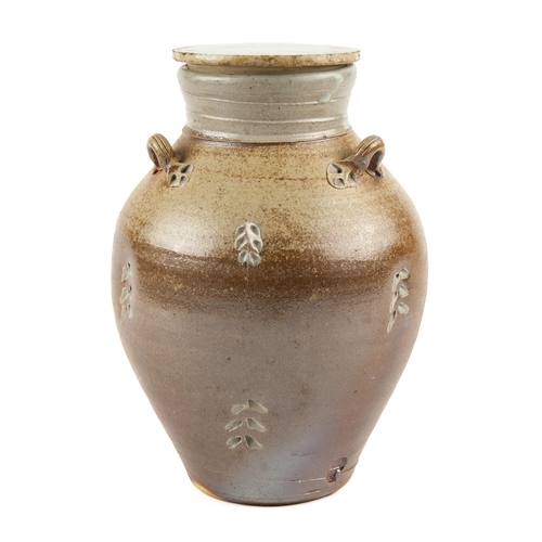 221 - A STONEWARE JAR AND COVER