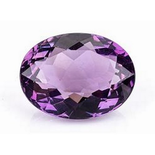 570 - AN OVAL AMETHYST