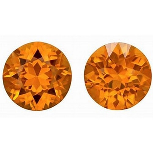 573 - A PAIR OF ORANGE GEMSTONES