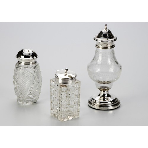 939 - TWO SILVER AND GLASS SUGAR CASTERS AND A MUSTARD POT, VARIOUS MAKERS AND DATES