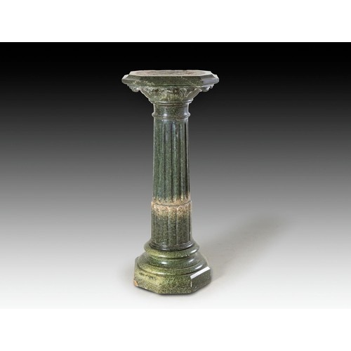 1056 - A CARVED GREEN SERPENTINE MARBLE PLINTH