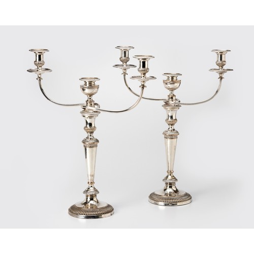 974 - A PAIR OF ELECTROPLATE THREE LIGHT CANDELABRA