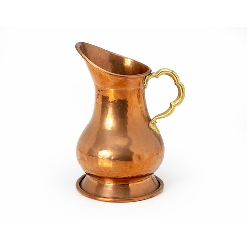 131 - A BRASS JUG