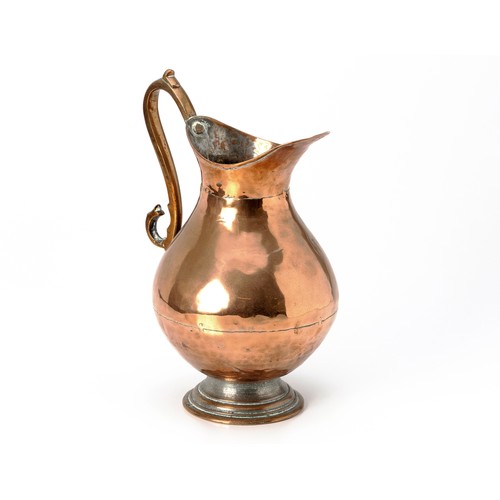 129 - A BRASS JUG