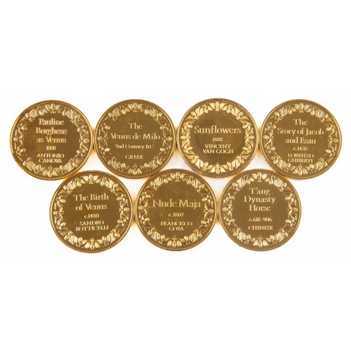 74 - A COLLECTION OF GOLD-PLATED SILVER MEDALLIONS