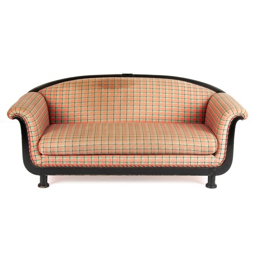 23 - AN EBONISED AND UPHOLSTERED SETTEE, MODERN