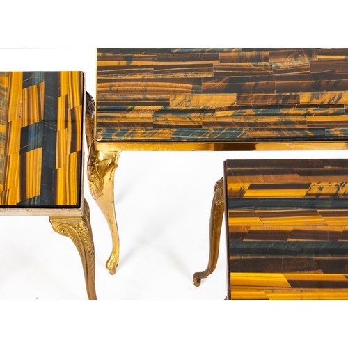 907 - A SUITE OF SIMULATED TIGER'S EYE AND BRASS COFFEE TABLES.