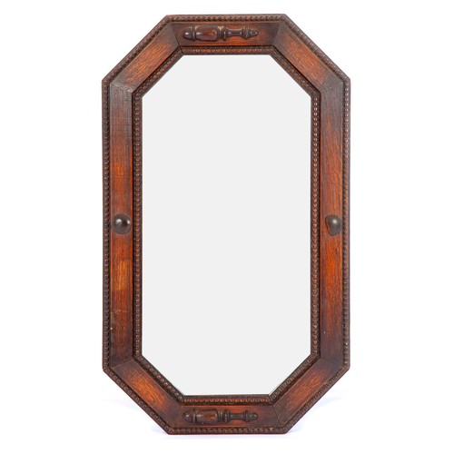 877 - AN OAK OCTAGONAL WALL MIRROR, EARLY 20TH CENTURY