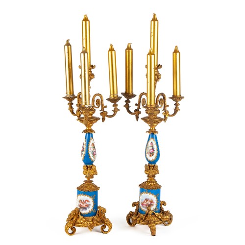 606 - A PAIR OF SEVRES-STYLE PORCELAIN AND GILT-METAL FOUR-LIGHT CANDLEHOLDERS