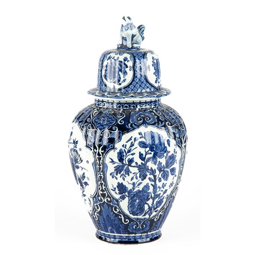 568 - A LARGE BLUE AND WHITE DELFT BALUSTER VASE AND COVER