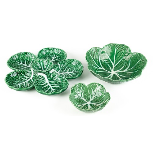 566 - A PORTUGUESE 'CABBAGE LEAF' PATTERN SNACK DISH AND TWO PLATES