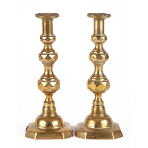 612 - A PAIR OF BRASS CANDLESTICKS