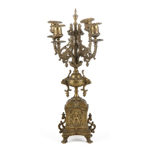 607 - A CONTINENTAL BRASS FOUR-LIGHT CANDELABRA