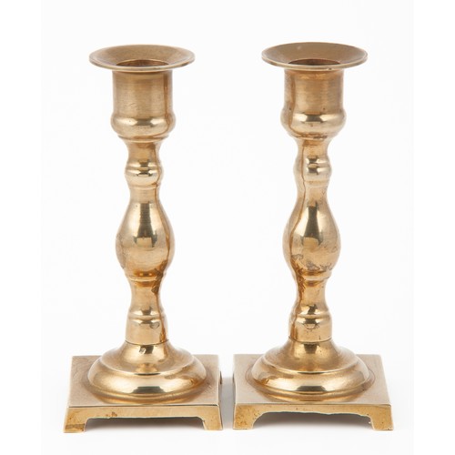 608 - A PAIR OF BRASS CANDLESTICKS