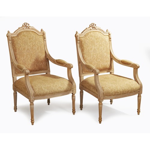 18 - A PAIR OF PAINTED AND UPHOLSTERED ARMCHAIRS